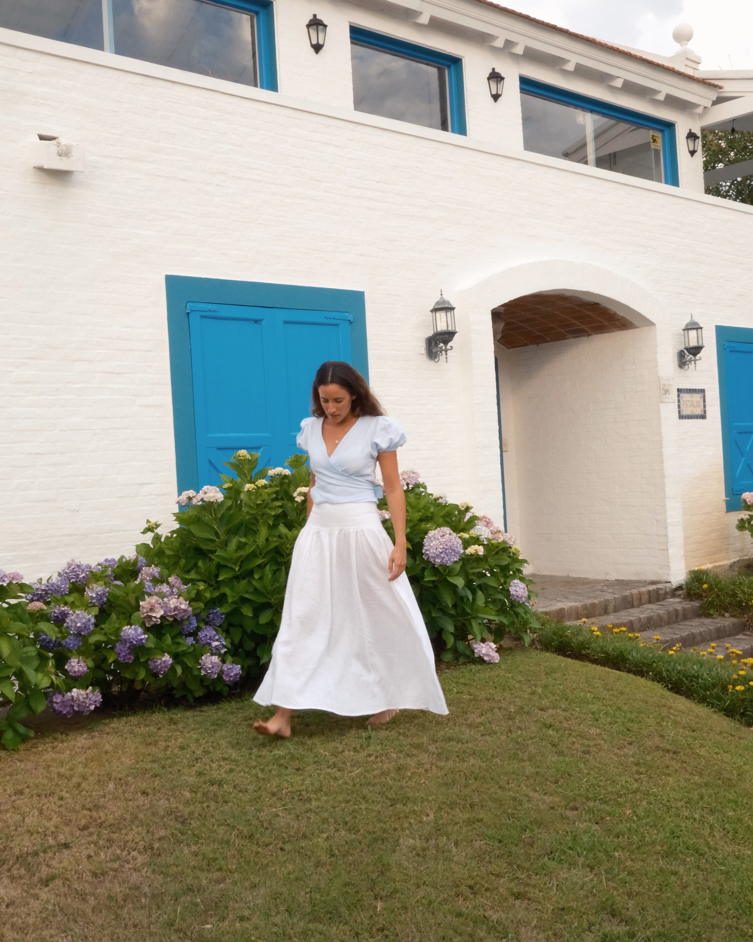 Woman in a white and abby blue linen set 